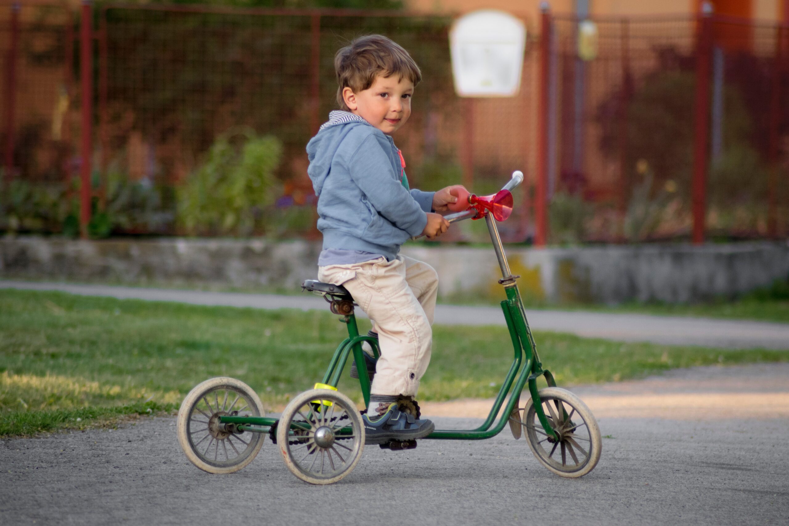 child on a tricycle